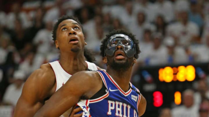 The Miami Heat’s Hassan Whiteside, left, fights for position under the basket against the Philadelphia 76ers’ Joel Embiid during the first quarter in Game 3 of a first-round NBA playoff series at AmericanAirlines Arena in Miami on Thursday, April 19, 2018. (David Santiago/Miami Herald/TNS via Getty Images)