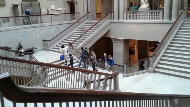 Visitors climb the ornate marble staircases in The Art Institute of Chicago, heading for the exhibit of four Rembrandt portraits in one second-story wing of the enormous museumChicago Art Institute