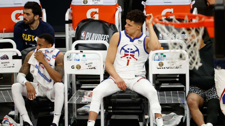 Michael Porter Jr. and Monte Morris of the Denver Nuggets react on the bench during the final moments in Game 2 of the Western Conference second-round playoff series versus the Phoenix Suns. (Photo by Christian Petersen/Getty Images)