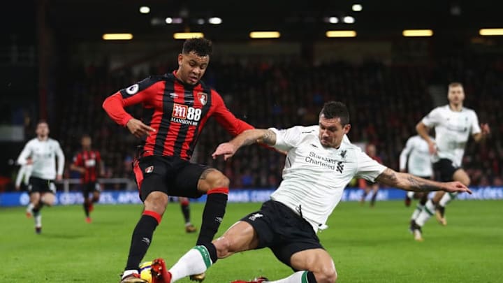 BOURNEMOUTH, ENGLAND - DECEMBER 17: Dejan Lovren of Liverpool tackles Joshua King of AFC Bournemouth during the Premier League match between AFC Bournemouth and Liverpool at Vitality Stadium on December 17, 2017 in Bournemouth, England. (Photo by Bryn Lennon/Getty Images)