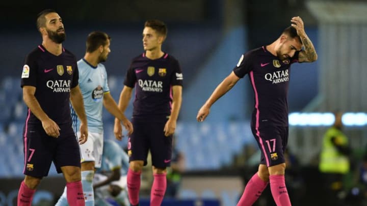 VIGO, SPAIN - OCTOBER 02: Arda Turan (1-L) and Paco Alcácer (R) of FC Barcelona react at the end of the La Liga match between Real Club Celta de Vigo and Futbol Club Barcelona (4-3) at the Balaidos stadium on October 02, 2016 in Vigo, Spain. (Photo by Octavio Passos/Getty Images)