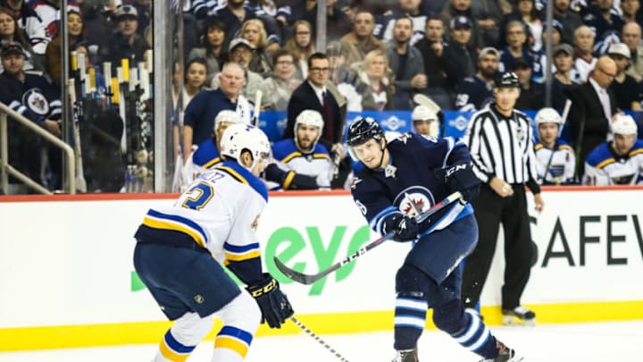 WINNIPEG, MB OCTOBER 22: Winnipeg Jets defenseman Jacob Trouba (8) takes a shot during the regular season game between the Winnipeg Jets and the St. Louis Blues on October 22, 2018 at the Bell MTS Place in Winnipeg, MB, Canada. (Photo by Terrence Lee/Icon Sportswire via Getty Images)