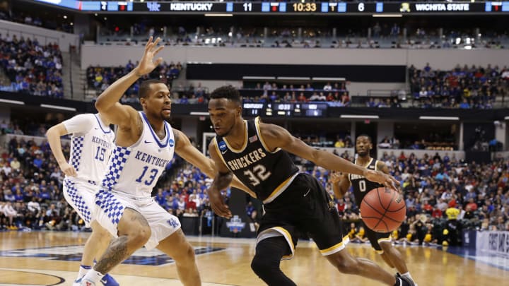 Mar 19, 2017; Indianapolis, IN, USA; Wichita State Shockers forward Markis McDuffie (32) drives to the basket against Kentucky Wildcats guard Isaiah Briscoe (13) during the first half in the second round of the 2017 NCAA Tournament at Bankers Life Fieldhouse. Mandatory Credit: Brian Spurlock-USA TODAY Sports