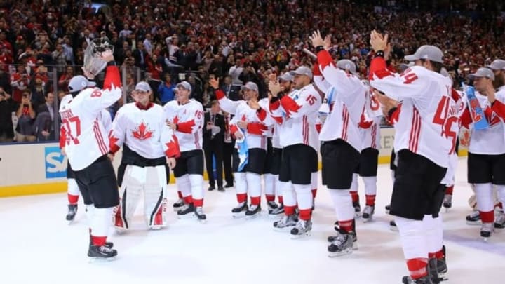 Sep 29, 2016; Toronto, Ontario, Canada; Team Canada center Sidney Crosby (87) passes the World Cup of Hockey championship trophy to his teammates after defeating Team Europe 2-1 in game two of the World Cup of Hockey final at Air Canada Centre. Mandatory Credit: Bruce Bennett/Pool Photo via USA TODAY Sports