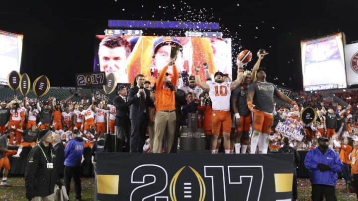 TAMPA, FL - JANUARY 09: Clemson Tigers head coach Dabo Swinney holds up the National Championship trophy after the 2017 College Football National Championship Game between the Clemson Tigers and Alabama Crimson Tide on January 9, 2017, at Raymond James Stadium in Tampa, FL. Clemson defeated Alabama 35-31. (Photo by Mark LoMoglio/Icon Sportswire via Getty Images)