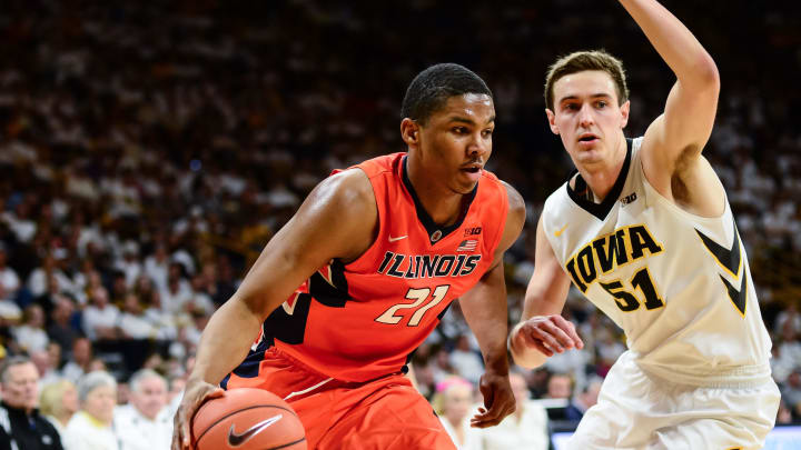 Feb 18, 2017; Iowa City, IA, USA; Illinois Fighting Illini guard Malcolm Hill (21) goes to the basket as Iowa Hawkeyes forward Nicholas Baer (51) defends during the first half at Carver-Hawkeye Arena. Illinois won 70-66. Mandatory Credit: Jeffrey Becker-USA TODAY Sports