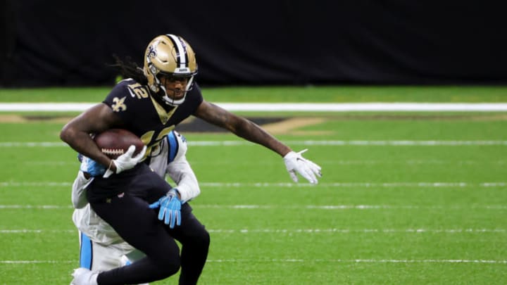 Oct 25, 2020; New Orleans, Louisiana, USA; New Orleans Saints wide receiver Marquez Callaway (12) is tackled by Carolina Panthers running back Jordan Scarlett (20) during the second half at the Mercedes-Benz Superdome. Mandatory Credit: Derick E. Hingle-USA TODAY Sports