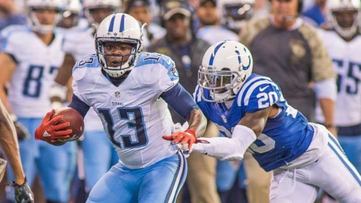 Nov 20, 2016; Indianapolis, IN, USA; Tennessee Titans wide receiver Kendall Wright (13) catches the ball and is tackled by Indianapolis Colts cornerback Darius Butler (20) in the second half of the game at Lucas Oil Stadium. Indianapolis Colts beat the Tennessee Titans 24-17. Mandatory Credit: Trevor Ruszkowski-USA TODAY Sports