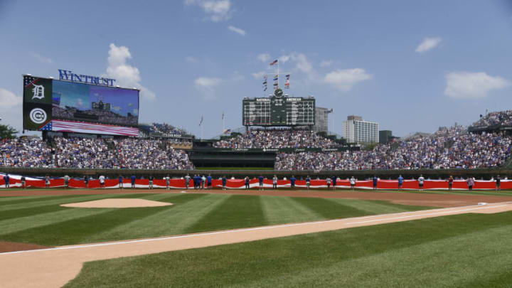 FanDuel MLB: CHICAGO, IL - JULY 04: An American flag on the field during the national anthem before the game between the Chicago Cubs and the Detroit Tigers on July 4, 2018 at Wrigley Field in Chicago, Illinois. (Photo by David Banks/Getty Images)