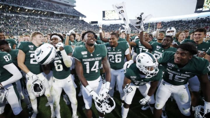 EAST LANSING, MI - SEPTEMBER 28: Michigan State Spartans players celebrate after a game against the Indiana Hoosiers at Spartan Stadium on September 28, 2019 in East Lansing, Michigan. Michigan State defeated Indiana 40-31. (Photo by Joe Robbins/Getty Images)