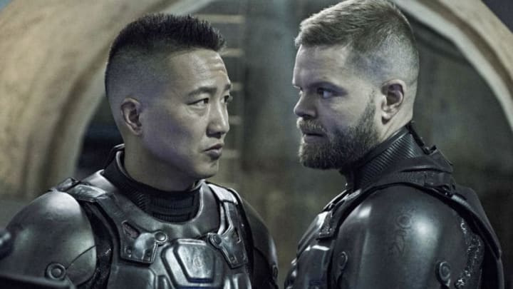 THE EXPANSE -- "Immolation" Episode 306 -- Pictured: (l-r) Terry Chen as Prax, Wes Chatham as Amos Burton -- (Photo by: Rafy/Syfy/NBCU Photo Bank via Getty Images)