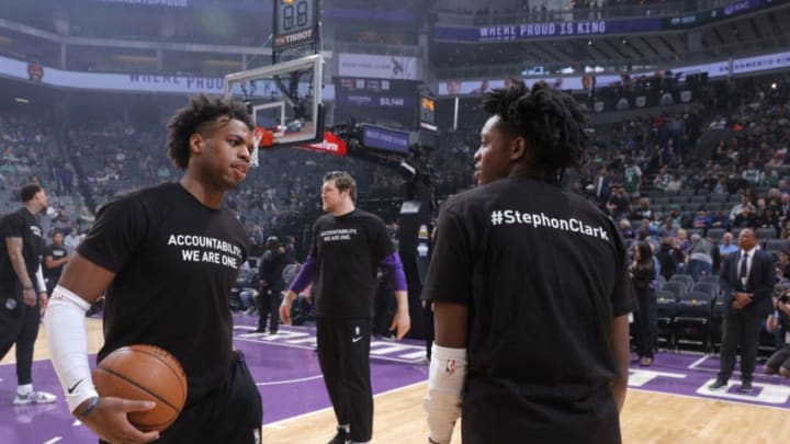 SACRAMENTO, CA - MARCH 25: Buddy Hield #24 and De'Aaron Fox #5 of the Sacramento Kings warm up with a shirt to honor Stephon Clark during the game against the Boston Celtics on March 25, 2018 at Golden 1 Center in Sacramento, California. NOTE TO USER: User expressly acknowledges and agrees that, by downloading and or using this photograph, User is consenting to the terms and conditions of the Getty Images Agreement. Mandatory Copyright Notice: Copyright 2018 NBAE (Photo by Rocky Widner/NBAE via Getty Images)