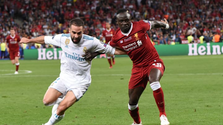 KIEV, UKRAINE - MAY 26: Dani Carvajal of Real Madrid and Sadio Mane of Liverpool compete for the ball during the UEFA Champions League final between Real Madrid and Liverpool at NSC Olimpiyskiy Stadium on May 26, 2018 in Kiev, Ukraine. (Photo by Etsuo Hara/Getty Images)