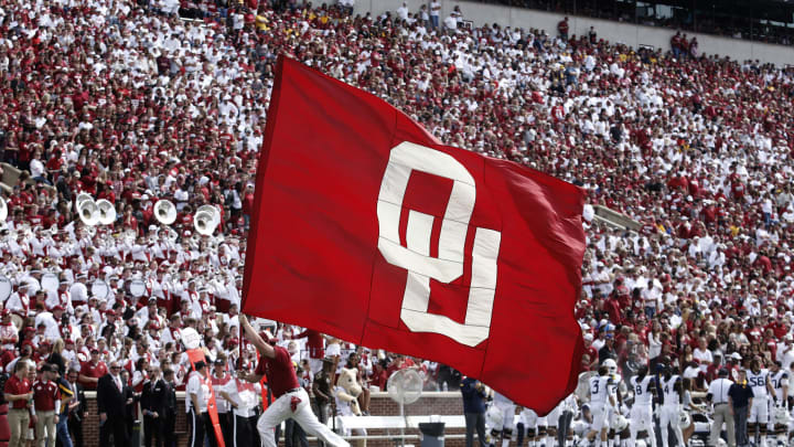 NORMAN, OK – OCTOBER 3: A member of the Oklahoma Sooners spirit squad celebrates a touchdown against the West Virginia Mountaineers October 3, 2015 at Gaylord Family-Oklahoma Memorial Stadium in Norman, Oklahoma. Oklahoma defeated West Virginia 44-24.(Photo by Brett Deering/Getty Images)