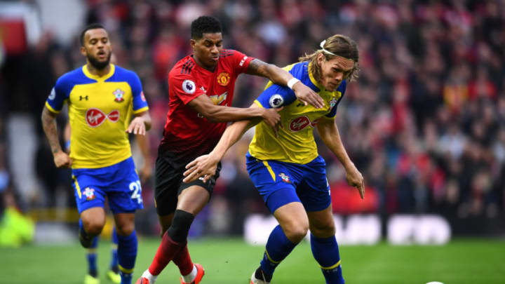 MANCHESTER, ENGLAND - MARCH 02: Marcus Rashford of Manchester United is challenged by Jannik Vestergaard of Southampton during the Premier League match between Manchester United and Southampton FC at Old Trafford on March 02, 2019 in Manchester, United Kingdom. (Photo by Clive Mason/Getty Images)