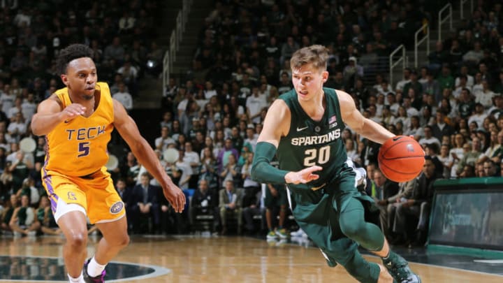 EAST LANSING, MI - NOVEMBER 18: Matt McQuaid #20 of the Michigan State Spartans drives past Johnnie Vassar #5 of the Tennessee Tech Golden Eagles in the first half at Breslin Center on November 18, 2018 in East Lansing, Michigan. (Photo by Rey Del Rio/Getty Images)