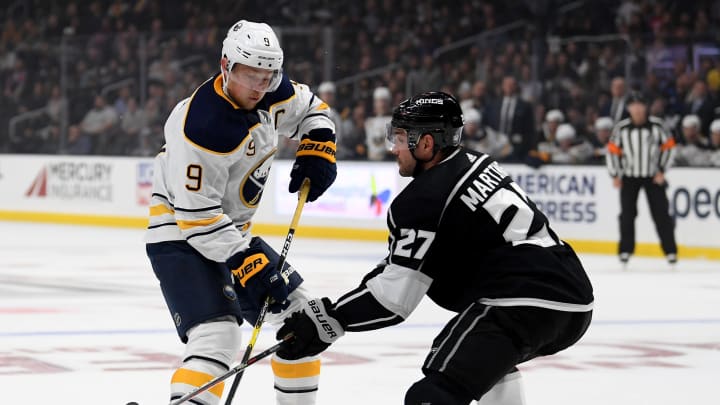 LOS ANGELES, CALIFORNIA – OCTOBER 17: Jack Eichel #9 of the Buffalo Sabres attempts to deek Alec Martinez #27 of the Los Angeles Kings during the first period at Staples Center on October 17, 2019 in Los Angeles, California. (Photo by Harry How/Getty Images)