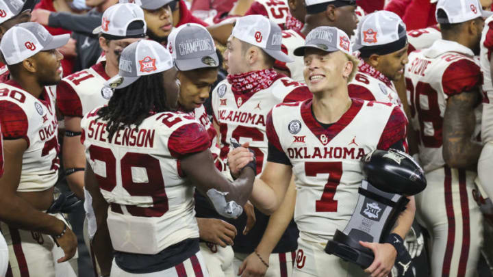 Dec 19, 2020; Arlington, Texas, USA; Oklahoma Sooners quarterback Spencer Rattler (7) laughs with running back Rhamondre Stevenson (29) after the game against the Iowa State Cyclones at AT&T Stadium. Mandatory Credit: Kevin Jairaj-USA TODAY Sports