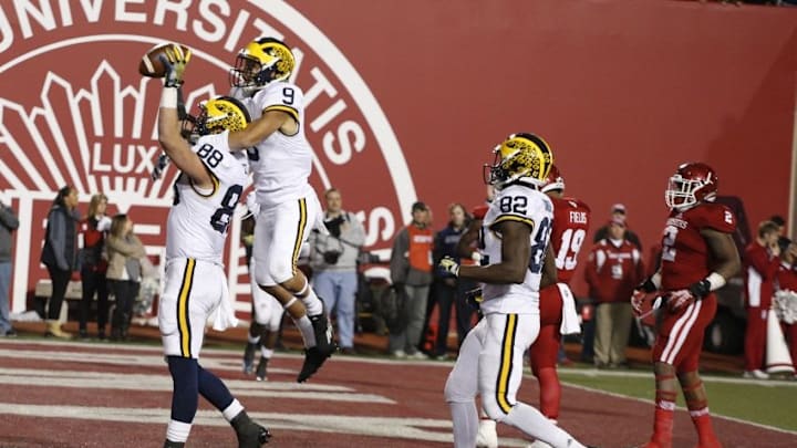 Nov 14, 2015; Bloomington, IN, USA; Michigan Wolverines tight end Jake Butt (88) after scoring a touchdown in the first overtime is congratulated by wide receiver Grant Perry (9) during a game against the Indiana Hoosiers at Memorial Stadium. Michigan defeats Indiana in double overtime 48-41. Mandatory Credit: Brian Spurlock-USA TODAY Sports