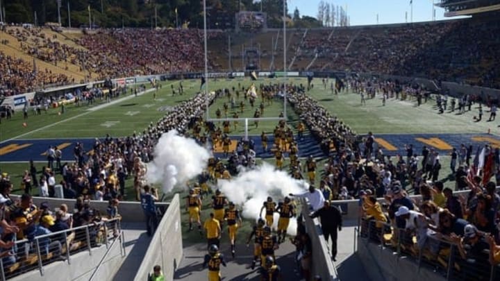 Nov 9, 2013; Berkeley, CA, USA; General view of California Golden Bears players entering Memorial Stadium through plumes of smoke before the game against the Southern California Trojans. Mandatory Credit: Kirby Lee-USA TODAY Sports