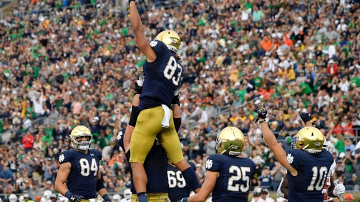 SOUTH BEND, INDIANA - OCTOBER 05: Chase Claypool #83 of the Notre Dame Fighting Irish celebrates with teammates after scoring a touchdown in the first half against the Bowling Green Falcons at Notre Dame Stadium on October 05, 2019 in South Bend, Indiana. (Photo by Quinn Harris/Getty Images)