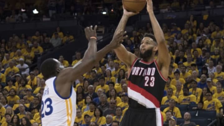 April 16, 2017; Oakland, CA, USA; Portland Trail Blazers guard Allen Crabbe (23, right) shoots the basketball against Golden State Warriors forward Draymond Green (23) during the third quarter in game one of the first round of the 2017 NBA Playoffs at Oracle Arena. The Warriors defeated the Trail Blazers 121-109. Mandatory Credit: Kyle Terada-USA TODAY Sports
