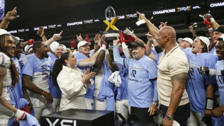 SAN ANTONIO, TX - MAY 13 : Bob Stoops head coach of the Arlington Renegades hold their trophy with teammates after they defeated DC Defenders in XFL Championship game at the Alamodome on May 13 2023 in San Antonio, Texas. (Photo by Ronald Cortes/Getty Images)