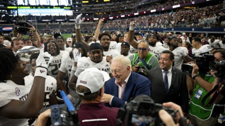 Sep 30, 2023; Arlington, Texas, USA; Texas A&M Aggies head coach Jimbo Fisher shakes hands with Dallas Cowboys owner Jerry Jones after the Aggies victory over the Arkansas Razorbacks at AT&T Stadium. Mandatory Credit: Jerome Miron-USA TODAY Sports