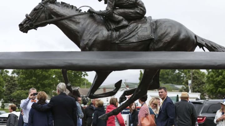 May 5, 2016; Louisville, KY, USA; Patrons and attendees pose for selfies with the Barbaro statue outside the main entrance during Thurby at Churchill Downs in advance of the 2016 Kentucky Derby. Mandatory Credit: Alton Strupp/Louisville Courier-Journal via USA TODAY NETWORK