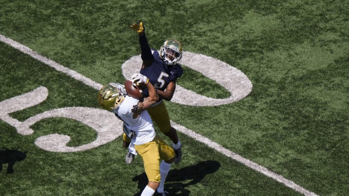 SOUTH BEND, INDIANA – MAY 01: Joe Wilkins Jr. #18 of the Notre Dame Football catches the football in the first half against Cam Hart #5 of the Notre Dame Fighting Irish Blue-Gold Spring Game at Notre Dame Stadium on May 01, 2021, in South Bend, Indiana. (Photo by Quinn Harris/Getty Images)
