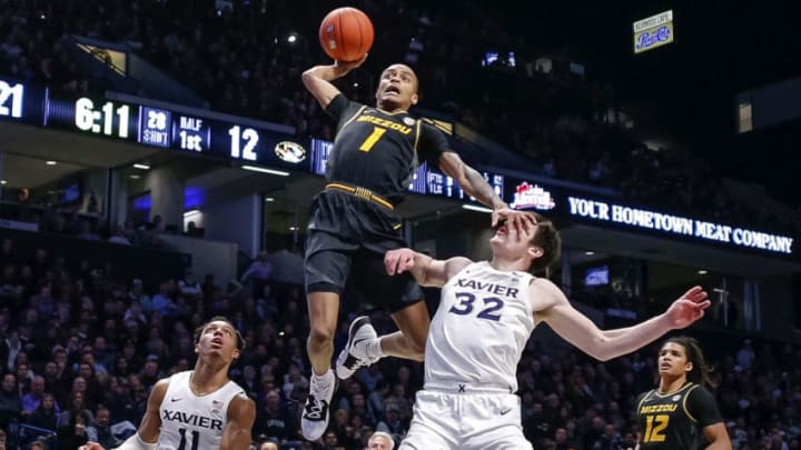CINCINNATI, OHIO - NOVEMBER 12: Xavier Pinson #1 of the Missouri Tigers goes up for a dunk attempt as Zach Freemantle #32 of the Xavier Musketeers defends at Cintas Center on November 12, 2019 in Cincinnati, Ohio. (Photo by Michael Hickey/Getty Images)