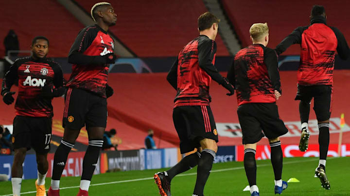 Manchester United's Brazilian midfielder Fred (L) and Manchester United's French midfielder Paul Pogba (2L) warms up ahead of the UEFA Champions league group H football match between Manchester United and RB Leipzig at Old Trafford stadium in Manchester, north west England, on October 28, 2020. (Photo by Anthony Devlin / AFP) (Photo by ANTHONY DEVLIN/AFP via Getty Images)