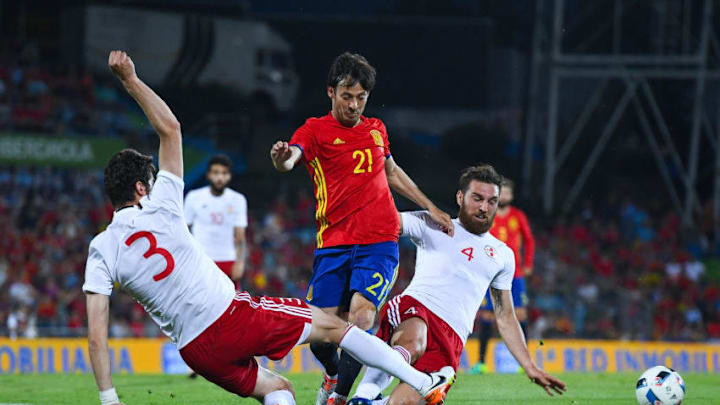 GETAFE, SPAIN - JUNE 07: David Silva of Spain competes for the ball with Kverkvelia (L) and Kashia of Georgia during an international friendly match between Spain and Georgia at Alfonso Perez stadium on June 7, 2016 in Getafe, Spain. (Photo by David Ramos/Getty Images)