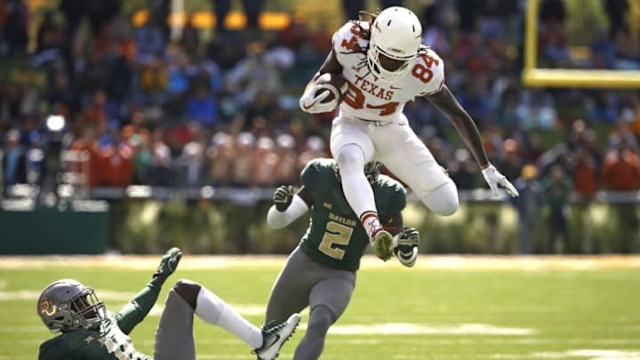 WACO, TX - OCTOBER 28: Lil'Jordan Humphrey #84 of the Texas Longhorns leaps past defenders Jameson Houston #11 and Taion Sells #2 of the Baylor Bears in the second half at McLane Stadium on October 28, 2017 in Waco, Texas. Texas won 38-7. (Photo by Ron Jenkins/Getty Images) WACO, TX - OCTOBER 28: Lil'Jordan Humphrey #84 of the Texas Longhorns leaps past defenders Jameson Houston #11 and Taion Sells #2 of the Baylor Bears in the second half at McLane Stadium on October 28, 2017 in Waco, Texas. Texas won 38-7. (Photo by Ron Jenkins/Getty Images)
