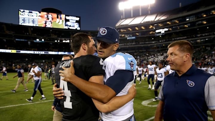 Aug 27, 2016; Oakland, CA, USA; Oakland Raiders quarterback Derek Carr (4) and Tennessee Titans quarterback Marcus Mariota (8) meet after the game at Oakland Alameda Coliseum. The Titans defeated the Raiders 27-14. Mandatory Credit: Cary Edmondson-USA TODAY Sports
