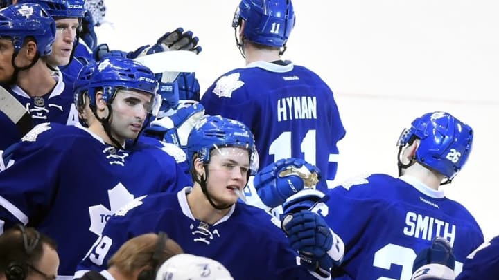 Mar 15, 2016; Toronto, Ontario, CAN; Toronto Maple Leafs center Zach Hyman (11) and right wing Ben Smith (26) are greeted at the bench by centers William Nylander (39) and Nazem Kadri (43) after Hyman