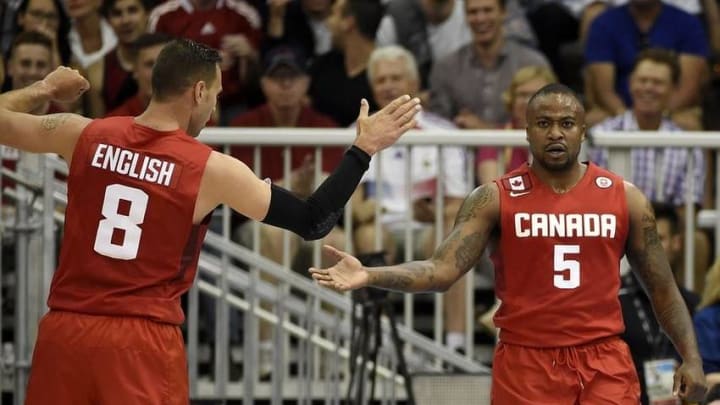 Jul 24, 2015; Toronto, Ontario, CAN; Canada forward Junior Cadougan (5) celebrates with Canada guard Carl English (8) after a play against the United States in the men