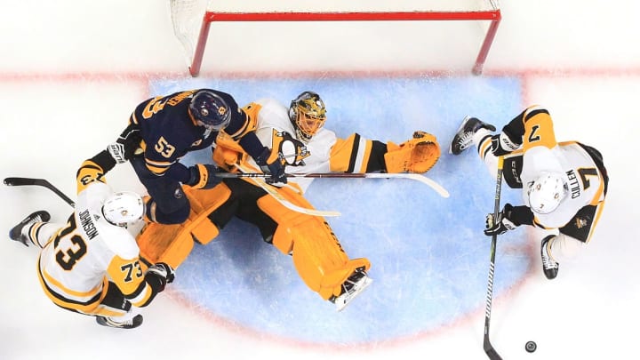BUFFALO, NY - MARCH 14: Matt Cullen #7 and Casey DeSmith of the Pittsburgh Penguins defend the puck against Jeff Skinner #53 of the Buffalo Sabres during an NHL game on March 14, 2019 at KeyBank Center in Buffalo, New York. Pittsburgh won, 5-0. (Photo by Bill Wippert/NHLI via Getty Images)