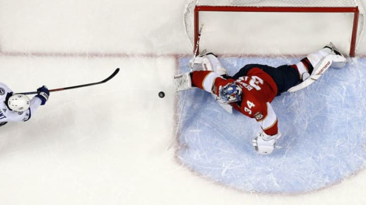 SUNRISE, FL - DECEMBER 1: Brayden Point #21 of the Tampa Bay Lightning scores in overtime for the win against Goaltender James Reimer #34 of the Florida Panthers at the BB&T Center on December 1, 2018 in Sunrise, Florida. (Photo by Eliot J. Schechter/NHLI via Getty Images)