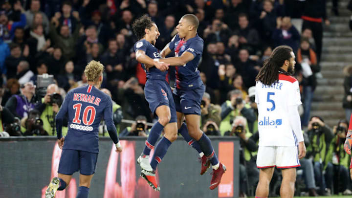 PARIS, FRANCE - OCTOBER 07: Kylian Mbappe of Paris Saint-Germain celebrates his fourth goal with Marquinhos and Neymar Jr during the French Ligue 1 match between Paris Saint Germain and Olympique Lyon on October 07, 2018 in Paris, France. (Photo by Xavier Laine/Getty Images)