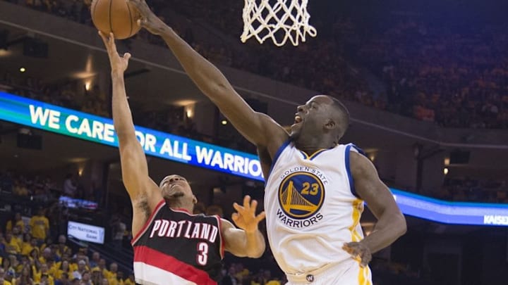 May 1, 2016; Oakland, CA, USA; Golden State Warriors forward Draymond Green (23) blocks the shot of Portland Trail Blazers guard C.J. McCollum (3) during the second quarter in game one of the second round of the NBA Playoffs at Oracle Arena. Mandatory Credit: Kyle Terada-USA TODAY Sports