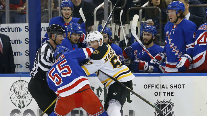 Feb 16, 2020; New York, New York, USA;New York Rangers defenseman Ryan Lindgren (55) throws a punch at Boston Bruins left wing Brad Marchand (63) during the first period at Madison Square Garden. Mandatory Credit: Noah K. Murray-USA TODAY Sports