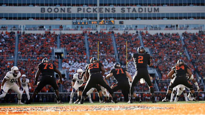 STILLWATER, OK - NOVEMBER 7 : Quarterback Mason Rudolph #2 of the Oklahoma State Cowboys takes a snap against the TCU Horned Frogs November 7, 2015 at Boone Pickens Stadium in Stillwater, Oklahoma. The Cowboys defeated the Horned Frogs 49-29. (Photo by Brett Deering/Getty Images)