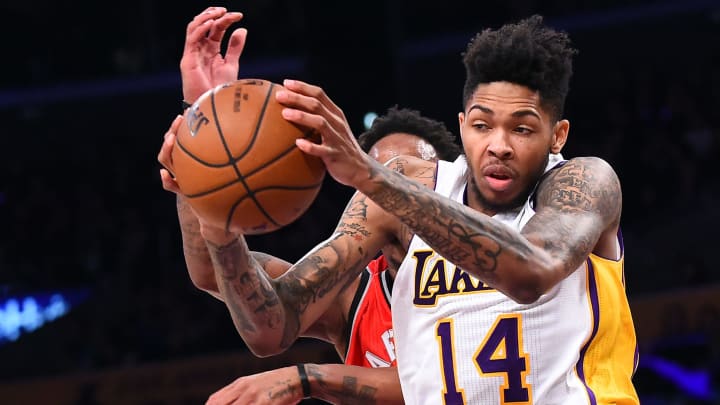 Jan 1, 2017; Los Angeles, CA, USA; Los Angeles Lakers forward Brandon Ingram (14) holds on to a rebound in front of Toronto Raptors guard DeMar DeRozan (10) in the second half of the game at Staples Center. Raptors won 123-114. Mandatory Credit: Jayne Kamin-Oncea-USA TODAY Sports