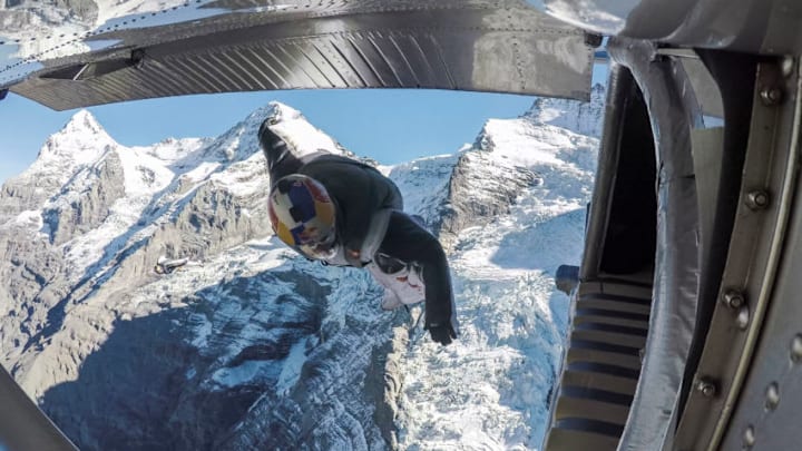 LAUTERBACH, SWITZERLAND - OCTOBER 13: In this handout image provided by Red Bull, wingsuit flyers Fred Fugen and Vince Reffet, known as the Soul Flyers, catching up and fly into a Pilatus Porter plane, piloted by Philippe Bouvier, in mid air after jumping off the Jungfrau mountain on October 13, 2017 in Lauterbach, Switzerland. After B.A.S.E. jumping from the 4,158 meters high mountain the French athletes had 2.45 minutes and a free fall distance of 3,200 meters to complete their project 'Door In The Sky', which was coordinated by Yves Rossy, know as the 'Jetman'. (Photo by Thibault Gachet/Red Bull via Getty Images)