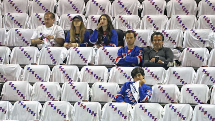 NEW YORK, NEW YORK - MAY 22: Fans watch warmups prior to the game between the New York Rangers and the Carolina Hurricanes in Game Three of the Second Round of the 2022 Stanley Cup Playoffs at Madison Square Garden on May 22, 2022 in New York City. (Photo by Bruce Bennett/Getty Images)