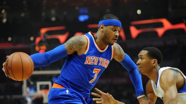 March 11, 2016; Los Angeles, CA, USA; New York Knicks forward Carmelo Anthony (7) moves the ball against Los Angeles Clippers forward Wesley Johnson (33) during the first half at Staples Center. Mandatory Credit: Gary A. Vasquez-USA TODAY Sports