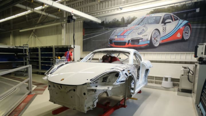 STUTTGART, GERMANY - FEBRUARY 19: Workers assemble Porsche Cayman GT4 car on an assembly line at the Porsche plant in Zuffenhausen district on February 19, 2019 in Stuttgart, Germany. European automakers who export to the United States are facing tariffs of up to 25% should U.S. President Donald Trump decide to impose them. Trump has been in an ongoing tiff with European nations over trade. (Photo by Thomas Niedermueller/Getty Images)