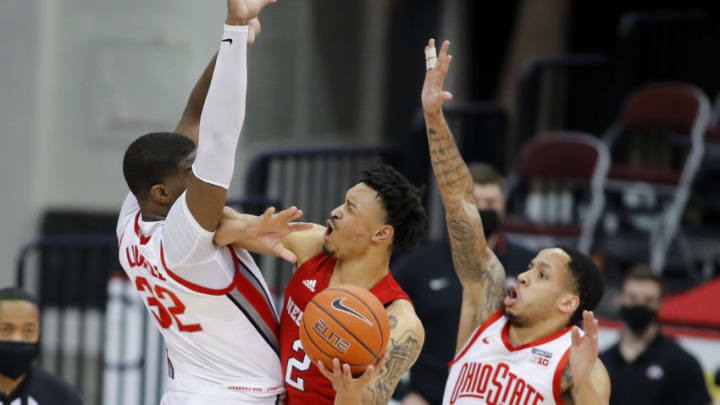 Dec 30, 2020; Columbus, Ohio, USA; Nebraska Cornhuskers guard Trey McGowens (2) defended by Ohio State Buckeyes guard CJ Walker (13) and forward E.J. Liddell (32) during the first half at Value City Arena. Mandatory Credit: Joseph Maiorana-USA TODAY Sports
