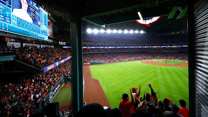 HOUSTON, TX - OCTOBER 27: Fans celebrate in the outfield during game three of the 2017 World Series between the Houston Astros and the Los Angeles Dodgers at Minute Maid Park on October 27, 2017 in Houston, Texas. (Photo by Jamie Squire/Getty Images)